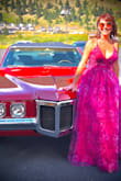 This was such a fun gown to wear! The colors are gorgeous! Purple and red. I ordered a medium, that usually fits well, but it was a little too small. The large fit great and I received so many compliments. I would recommend steaming out the gown before wearing it. I love this gown and can't wait to have an excuse to wear it again. - Emer M.