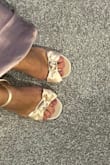 I felt the strap might be a SMIDGE tight but not bad. The shoe fit overall good. But I love the bow. Love the satin material. Very cute overall. - Aly V.