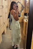 This dress was so beautiful in the pictures that I couldn't wait to get it. Very good quality. There's no give at the waist so make sure you measure and follow the size chart.  I read reviews about the zipper. I didn't have problems if I took my time zipping it up at the waist where the fabric is thicker. I'm short so it fit ankle length which was perfect. It's flowy and not stiff. Color is just as beautiful in person as in the picture! I had so many compliments on this dress! - Michelle T.