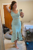Absolutely love this dress! I have an hourglass shape with a larger bum so I definitely had to squeeze and stuff my hips and butt into the dress. It's right on the edge of being too tight. Due to this, it wanted to ride up my hips, but putting spandex shorts on underneath helped eliminate that problem. However, the torso fits perfectly so I think a size up would've been too loose there for me. Such a beautiful color and shape to the dress, I received so many compliments at the wedding I wore it to and was even called best dressed! - Bridget P.