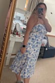 I ordered this dress for my engagement session! There were no reviews when I purchased it, and it said "this fabric has no stretch" I was a little nervous so I ordered a large and an XL just in case. I did not even try on the XL because the L fit perfectly! Slightly loose in the waist, but I would rather that than too right! The bow tie in the back is the cherry on top! You can make it tight enough so you don't need a bra, it has great support! It's very similar to a linen material, so it was a little wrinkly, but the Downy Wrinkle spray does wonders! Highly recommended! - Annie T.