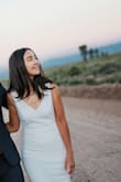 I got this dress for my elopement and it looked great! I wore under 3 inch heels and no alterations were needed. The quality is very good. Many people thought that this dress was custom made for me. - Aigera M.