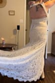 I really wanted to love this dress. I was expecting it to be my favorite, but it was made for slimmer, longer torsos. Not made for people of my shape. The body of the dress ran small, but the top of the back was way too big which I feel wouldn't be an issue for longer torsos. For me personally, the slip underneath would need to either be cut or sewn to the dress in the front to hide it. I've seen lots of reviews with women leaving it and it looks just fine, but I did not like that. I loved the long train! - Kaetlyn M.