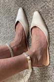 Very pretty shoes! Toe is long and pointed/narrow. Shoes have more structure than appears in the website photos. - Katelin Z.