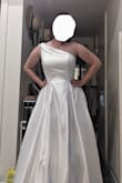 I honestly wasn't sure about buying a wedding dress online, but it fits perfectly and I'm so happy! It is a gorgeous dress, it feels well made, it's got a slip layer, a tulle layer, and the outer layer, and the top has boning which makes it feel super supportive and structured. There's a bit of room in the bust, if you have similar measurements to me but have larger boobs I would say still get it because it will probably fit. The length is quite long so don't worry if you are tall either. I will need to get the length hemmed to fit. The fabric is thick and doesn't breathe at all so after wearing it for an hour I was getting a little sweaty, but I think that is true for most wedding dresses. Shipping didn't take very long either, I'm from Canada so I did have to pay duties which was an extra $30. I absolutely love it and can't beat the price either! - Jenna L.
