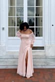 I loved this dress! Its much more pink in person than in the photo they provide. It fit well! I wear a size 10 in pants for reference so the Medium fit my waist perfectly and was close enough up top that it was not sagging at all over my chest. It loved the material and the detailing of the buttons on the wrists. - Sarah W.