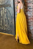 This dress was gorgeous! I got so many compliments. The bust was a little loose so I had to put some double-sided tape on my stick-on bra. The slit up the side is also not very noticeable but that didn't bother me. It was a little long but I wore heels so I didn't get it altered. - Denzie H.