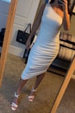 I love this dress. I first bought it in black and it was perfect. Fits true to size. Didn't have to wear a bra with black but needed to with white. - Nicole D.
