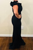 The dress is absolutely stunning and fits like a glove. The material is of good quality and has a beautiful stretch to it. The dress is sure to hug your body in all the right places! The dress is even more beautiful in person! Would highly recommend this dress to everyone! A must-have for a great price! This is a medium. - Joy C.
