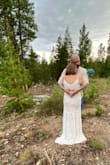I loved the color, and the lace, I liked the classic look, and was fitted & flattering!! One thing, it was a tish long but I'm only 5' 3 1/2", but more so, the zipper got caught in one spot, and it took my hubby and daughter to get it closed, it didn't break. So that's good!! Overall, it was a great elopement dress! - Apryl S.
