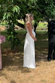 I love this dress. I am so glad I decided to go with this one. I just had my wedding and I am 20 weeks pregnant with my 6th baby. It fits perfectly for my bump and was great for an august wedding in the pacific northwest. I wore a nude bra under. The length does run a little long but it was pretty and flowy. The dress itself has weight to it as well. We had it dry cleaned the week of the wedding to keep out all the wrinkles for the big day. The only thing I can say about this dress that is even negative is that the zipper over the lace does get a little hard to zip and can get stuck. I ended up putting bar soap on it to make it move. The customer service at Lulus is above and beyond. They were willing to ship me a new dress and refund the cost when I told them about the issue. I have never experienced such kindness from a online clothing store. Will be recommending this website to everyone and coming back to buy a dress again for a special event. Thank you Lulus for making my special day perfect! - Rachel B.
