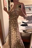 This dress is BEYOND gorgeous. Bought it to attend a wedding. The bust does open up a bit and doesn't truly have the ability to be adjusted, but nothing a quick tacking can't fix. I'm in love. - Reilly D.