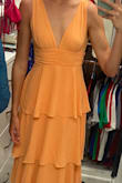 This dress is so perfect for weddings, showers, and all the events. It's comfortable and flowy and is a beautiful light orange color! Love that it hits me at the knee as well since I am a taller woman. - Kellyn S.