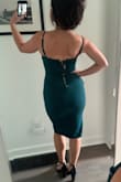 The material is thick and the straps are adjustable which I like for my height. It is stretchy but holds its shape. I went with a medium. The small was unflatteringly tight on me, the slit didn't fall right. The neckline is super flattering. I won't wear a bra but maybe some pasties. My seamless underwear shows even through the thicker fabric so I will have to find something else. The length is just what I wanted. Feels appropriate for the tightness of the dress at a formal event. It's going to be a showstopper and I can't wait to wear it! (The zipper is only not fully zipped because it was hard to do myself.) I'm obsessed with the emerald color! - Laura D.