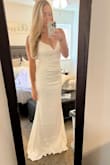 This dress arrived days before our elopement ceremony. It fit perfectly; I typically would have gotten a size 4 but wanted to be sure it wouldn't be too small since I didn't have much time to exchange.  I ordered a size 6, it fit well(but I could have gotten away with the size 4) it was pretty long and the material is a little stretchy! - Kelsey M.