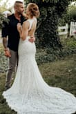 I bought this dress very last minute for our upcoming outdoor nuptials. When it arrives I immediately tried it on and it fit like a glove! I give credit to the reviews I read and the fit guide test provided. I will say I made some small alterations to make the dress more me. I first cut off the scalloped edges from the neckline and open back. This took about 20 minutes, a steady hand and a sharp pair of sewing scissors. I also fabric glued the nude colored slip to the lace exterior to have a sleeker, more polished look as I didn't want the slip peeking out like it previously had.

If you're looking for a cheap but very classy dress that helps make you feel beautiful on your wedding day, this dress is for you! - Kaitlyn D.
