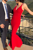 This dress is so flattering. It fits really nicely and hugs your body without feeling tight. The color is a bright red (seemed neutral, not orange- nor blue-toned). I wore this to my cousins wedding in Lebanon in August; it was pretty hot & humid out, but I was comfortable. I wore 3-inch heels and the length was great. Bonus: no ironing needed; I just hung it the day before. - Rula K.