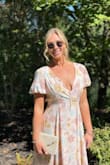 This dress was so much fun and easy to wear! I loved the pockets and open back. The medium fit me but was a little tight around my ribs so sized up. It fit great besides being a little big in the bust. I got so many compliments!! I wore it to a summer wedding and it was exactly what I was looking for! The sleeves were a cute touch! - Kelsey H.
