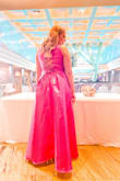 I was obsessed with getting this dress in fuschia so you can imagine how disappointed I was that the size Large wouldn't close in the back for me with the zipper and a size up XL was sold out. So I did the next best thing: had a tailor customize the back for me into a back-tie option. Looked just as great! Bought this in navy blue as a backup in the bigger size but the color just did not wow me. I wore the pink dress to a recent wedding and got so many compliments that the hassle of it all was worth it. It gave me a nice shape and covered my midriff which is always a struggle. And the best part of this dress are the POCKETS! - Jessica T.