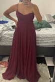 I ordered this dress expecting it to be some shade of burgundy as shown in the photo. I received a plum-colored dress, the packaging was labeled plum. The color needs to be renamed because in no way is it burgundy. The dress fit great and would have only needed altering for length. However, I needed a burgundy dress, not plum so I had to return it. I'm attaching photos of myself in the dress and holding a burgundy swatch (the color I needed to match). - Robyn F.