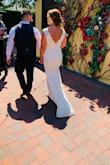 Omg! This was the most amazing wedding dress!! I had purchased another Lulus wedding dress and this as a "backup". The pictures on the site don't even begin to do this dress justice. It is just so stunningly beautiful and SO comfortable!! I have gotten so many compliments on it. One of the best wedding decisions I made! So flattering and classic. And that train?? Just wow! I did have an aunt who is a seamstress tweak it to my body, but all it really needed was to be hemmed. I can't explain how much I recommend this dress! - Monika H.