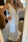 This dress. It did it for me. It must be so popular because medium and large were out of stock. I ordered a small with my fingers crossed. Let me just say I couldn't even sit down in it, let alone walk comfortably.. but lucky for me I'm very short. I brought it to a tailor and she is bringing it up just under my chest giving me more room in the hips (I even tried several brands of shapewear!). This will also maintain the intricate design of the skirt. Win win! It's very complicated with all the sequins, so if you need it altered, expect to pay a pretty penny! I feel beautiful in it though. Worth the extra effort for the big day! - Lydia F.