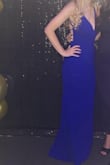 I got so many compliments on this beautiful dress. The color is vibrant and the back detail is stunning. The material is thick and well-made. I'm 5'8 and the length was perfect on me. Will definitely be ordering more from Lulus! This dress is perfect! - Reille A.