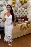 Wore this dress at my bridal shower this past weekend-it was perfection! Loved the midi length on me (5 foot 8 inches tall) and the lace detail at the bottom of the dress. Received so many compliments. I am a size 6 and medium in most dresses-had to return this dress for a small, so I would say it runs big in the thigh/skirt area. The bust and ribcage were snug and offered good coverage, with adjustable straps. The first dress I ordered came with a snagged zipper in the back and Lulus sent me a replacement dress at no charge within three days. Excellent customer service. And the shoes are Lulus too! Tall women should definitely buy this dress! - Yasmean T.
