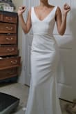 This fabric is really thick and lovely. It fit as if I had it tailored right away, and it has stretch in it too. The straps even have this little rubber lining so they don't slip at all, and it came with a quality garment bag. I cant believe how affordable it was- thank you! I ordered the XS and i usually wear a size 0/2 - Jackie O.