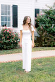 I ordered this jumpsuit for my bridal shower and I could not be more pleased. The jumpsuit is completely lined which is perfect because it isn't see-through. The quality is wonderful and the fabric has some weight to it, making it feel more expensive than it is. That being said, it's still light and airy so you won't overheat! I love the open back and it was perfect with a sticky bra. I received tons of compliments on it and I just love it! - Jamie J.