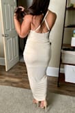 I absolutely adore this dress, it is flattering in every way. It accentuates my hips and it hugs just right, not too tight or uncomfortable at all. The only thing is that it's quite revealing in the chest area, and also it seems like more of an off-white/cream color to me rather than champagne. Other than that I'm absolutely in love! - Lauren H.
