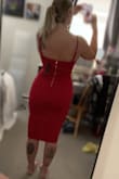 I absolutely love this dress. I bought to wear for a wedding reception. It hugs my curves in all the right places! The length and neck line are so flattering. The color is beautiful, it is the perfect true deep red which will look amazing on all skin tones since it is such a neutral red! Absolutely love love love, I can't wait to wear it! - Madison S.