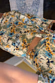 I ordered a medium because I have hips and a butt and knew that my waist might be a little big but the waist is huge however if I had ordered the small there's no way it would go over my hips. If the fabric just had some stretch it would be a piece worth purchasing but the fabric is so cheap. And now I'm stuck with it bc it's all sales final &.. beyond annoyed. - Elise M.