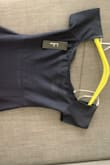 The dress I received had white stains on the back of it. I brought it in for dry cleaning but they were not able to remove the stain. I am super bummed. It fits great.  Trying to get in contact with someone for a return - Elizabeth M.