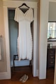 I wore this dress to my elopement wedding ceremony and it was perfect! It was casual yet elegant and of high quality. It is exactly as pictured. It was more tight fitting on me than the model but still looked beautiful. I would say this dress would look great flowy or snug. Maybe get a size up if you truly want it to be flowy like in the model image. - Millie J.