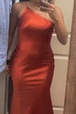 So I originally ordered a S and though it wasn't super big on me it was big enough (in the chest and waist area) that I would've had to get it altered. I took a leap of faith and decided to order a size down and it fit perfectly! My waist was snatched, it wasn't tight on my hips and my chest was properly secured lol It's a beautiful color and it does have some stretch, my only concern is that the zipper is on the size where the strap is which makes me concerned that it will snap since the strap is like a stretchy bra strap material. - Sheyenne D.