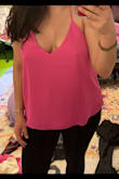 I ordered this top in pink and ivory during the Labor Day sale in a M (I'm typically a M in Lulus, occasionally a L) but exchanged for a L as the M was just a little too snug around my bust. These camis are loose and flowy, albeit a bit boxy in shape as they aren't very long. They are pretty low cut so not work appropriate but great for more casual occasions!
First photo is M - not as low cut, but it was so tight around my chest that the fabric was bunched up on my back.
Second photo is L - way more revealing but overall a more flattering and comfortable fit. - Tiffany S.