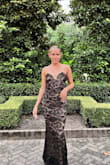I wore this dress for a black tie wedding in New Orleans and received so many compliments. The dress fit well, I'm a bit small-chested so I definitely had to pull it up a bit throughout the night. It was beautiful, comfy, stretchy and a good length. I'm 5'6 and wore a shorter heel so the dress drug on the ground a bit. I will say that leaves did stick to the lace on the bottom of the dress and I had to pull them out ripping the bottom a bit and the clutch I had rubbed against it making the lace pill in that spot. Probably just a one-time use dress, unfortunately. - Bailey A.