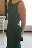 The fit is so perfect, what gives this dress the look is the open back with a bow across the bottom. - Jamie P.