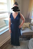I bought this dress for a winter wedding, and I cannot wait to wear it. The color is more vibrant in person and the fabric is super soft and stretchy. The only concern I have is that it is low cut in the front. - Rachel O.