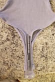 I really love the fit, look, and color of this body suit! My complaint is that the lower front part that goes on the crotch is almost as thin as the thong part. It's not even half an inch wider than the thong part, as you can see in my photos (pictured from the back). Idk it's so shockingly little to me that I included a pen in one pic for reference. = It's not so awful that I'm not keeping it and won't wear it, but it's not the most comfortable. 

Based on other ratings, I'm sure this is fine for many women. But if you are someone that doesn't enjoy fabric riding up "there," here is your heads up! - Mia Z.