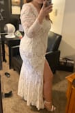 I have a 50 inch booty so I had to get a 1x but I'm small from the top so I had to get my sleeves and waist taken in but such a beautiful dress and such great quality for the price! I felt like a beautiful bride in this for my backyard wedding. I would buy again in a heartbeat - Lesli B.