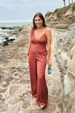 This was such a fun and comfortable outfit! I wore it to a party that requested 70's Tijuana cocktail attire. It was such a blast to wear and everyone loved it. My favorite part about it: zero camel toe! I have a long torso and that tends to happen in one-pieces, but it didn't with this! I absolutely love the color too. This outfit is even better in person, and I paired it with snakeskin mules that maybe have a two-inch heel, and it was still long enough for me. If you are on the shorter side wear really tall heels with it. - Sarah L.