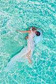 My one requirement for my wedding was to swim in my dress, hence the price point I was looking at. I couldn't have been happier, this dress has bang for the buck with thick quality materials and even survived the washing machine post-wedding swim! It fits true to size and the backless detail with the train is stunning, highly highly recommend it. :) - Amanda K.