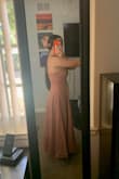 Got this dress for a baby shower I'm going to and thought it was a great length and color for the occasion. Dress is a nice material and has pockets which is always a plus. The dress is a bit long for a midi, but I am short so that may have to do with it. My only complaint is the chest area of the dress is definitely small, tight, and I find myself spilling out of it. The rest of the dress fits perfectly, but might not be the right dress or size for someone who is larger chested. Overall, I would recommend this very pretty dress. (Shipping was also very quick and received it within a few days of ordering). - Emerson W.