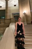 I had probably as many compliments on my clutch as my actual dress! It is so cute and fun to hold a bunch of different ways. Personally in the photos I think it came across a touch briefcasey but others liked it. I switched to the gold chain by cocktail hour.

For me, it held: my phone, a lipstick (fitting the lipstick and phone together was not easy), a mask, Bobby pins, ID/credit card, house keys and the card I brought for the wedding couple. It popped open once but I think it was because the lipstick and phone were not cooperating with each other in there. - Kitty H.
