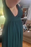 I was very happy with how this dress came out, but I did make some changes. I wear a 34I, not the 34DDD that was the highest they'd let me choose for this review. I'm also on the shorter side, so I knew I would need to get this tailored. I ended up taking a few inches off the hem and using some of the excess material to increase the width of the bust pieces. I know that's a style, but I felt very exposed on the sides before alteration, almost like the amount of fabric in the bust hadn't changed with the increasing size. I only have room for two photos here, so I've included a front picture and a picture of the pre-altered side. I needed to create a tape bra to wear with this, which you can see some of in the photo of the pre-altered dress. It was definitely tricky with my larger bust, but overall I'm really happy with the way I looked. Took some work, but worth it IMO! - Taylor D.