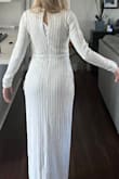 Beautiful, not skin tight. Absolutely love the material, the sequins are of high-quality and the slit in the dress as well as the V-neck are so sexy. I got three dresses to Try on for my wedding rehearsal night I think this one would be perfect if it was in the winter. - Danielle D.
