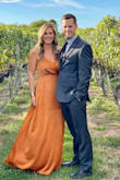 I wore this dress to a fall wedding. I loved the color and got many compliments on it. The fit of the dress was flattering and comfortable. The only thing is, it is pretty long. I did not have time to get it hemmed, so even being 5'7" I had to wear really high shoes. - Jessica L.