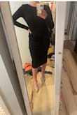 The back of this dress is stunning and the fit has a decent stretch to it. I have a athletic built and probably could have worn a small too if I wanted it to be a little more snug and for the sleeves to be a tad shorter. I ended up returning though because it felt a little to stiff and too business like for the type of wedding I was going to. The material is definitely thicker then what I was expecting so it's good for a cold weather event. - Jenna A.